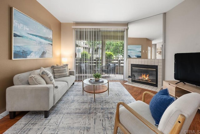 7398 Park View Ct Unit 135, Santee, CA 92071 - living room with wood finished floors and a tiled fireplace
