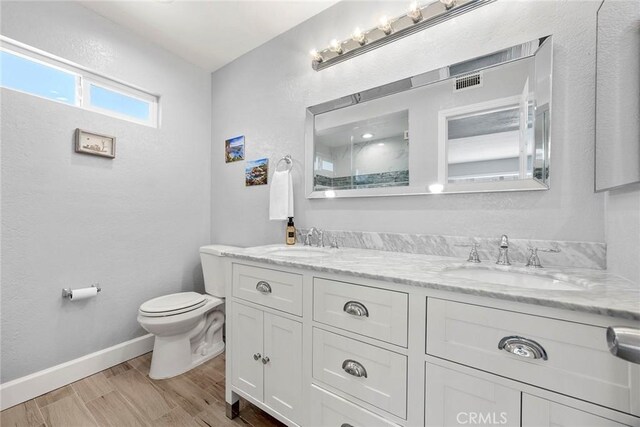 17776 Buena Vista Ave, Yorba Linda, CA 92886 - full bath featuring toilet, double vanity, wood finished floors, baseboards, and a shower