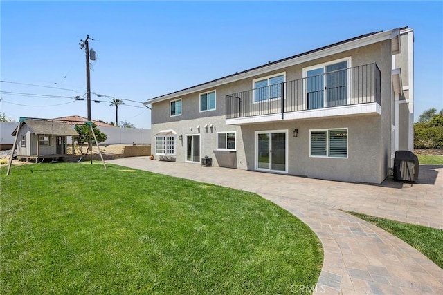17776 Buena Vista Ave, Yorba Linda, CA 92886 - back of property with stucco siding, a balcony, a patio area, and an outbuilding