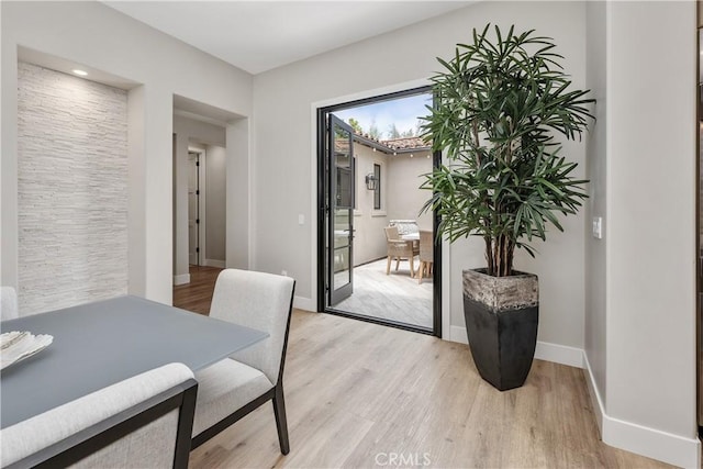 8126 Santaluz Village N, San Diego, CA 92127 - dining room featuring light wood-style flooring and baseboards