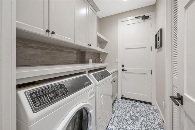 8126 Santaluz Village N, San Diego, CA 92127 - laundry area with washing machine and dryer, cabinet space, and light tile patterned flooring