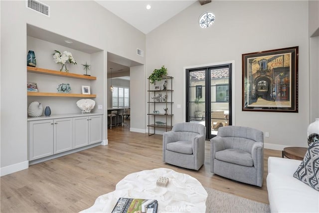 8126 Santaluz Village N, San Diego, CA 92127 - sitting room featuring light wood finished floors, high vaulted ceiling, and baseboards