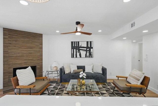 1915 Via Las Palmas Unit 32A, National City, CA 91950 - living room with recessed lighting, a ceiling fan, baseboards, a fireplace, and wood finished floors