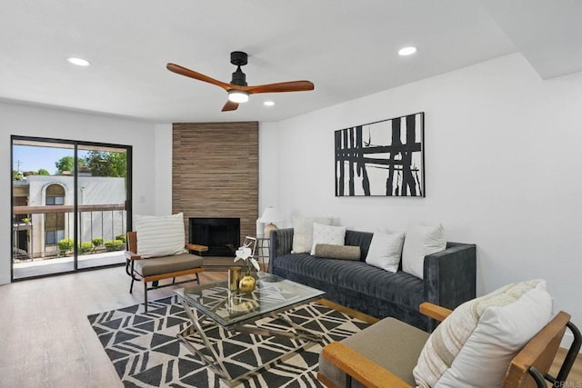 1915 Via Las Palmas Unit 32A, National City, CA 91950 - living area featuring wood finished floors, ceiling fan, recessed lighting, and a fireplace