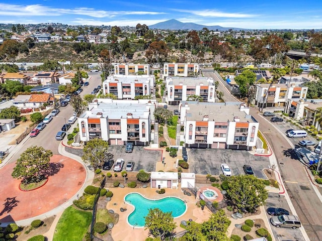1915 Via Las Palmas Unit 32A, National City, CA 91950 - aerial view of property and surrounding area featuring a pool and a mountain backdrop