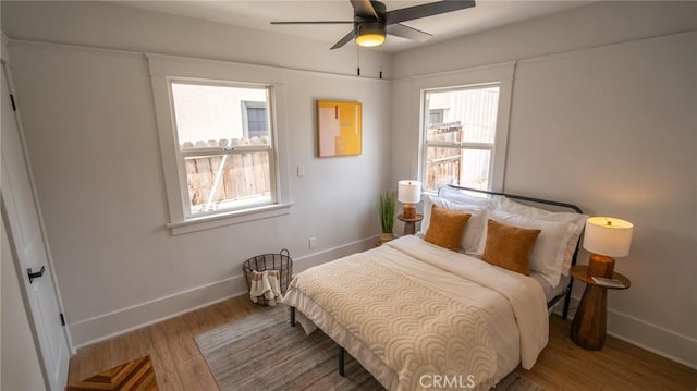1520 Ohio Ave, Long Beach, CA 90804 - bedroom with baseboards, wood finished floors, and a ceiling fan