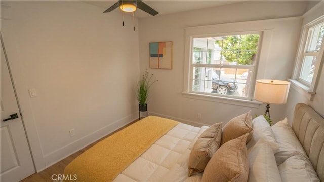1520 Ohio Ave, Long Beach, CA 90804 - bedroom with baseboards, wood finished floors, and a ceiling fan
