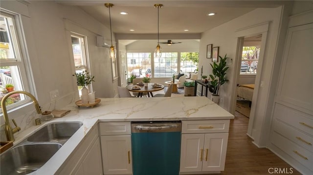 1520 Ohio Ave, Long Beach, CA 90804 - kitchen featuring a sink, dishwasher, a peninsula, wood finished floors, and white cabinets