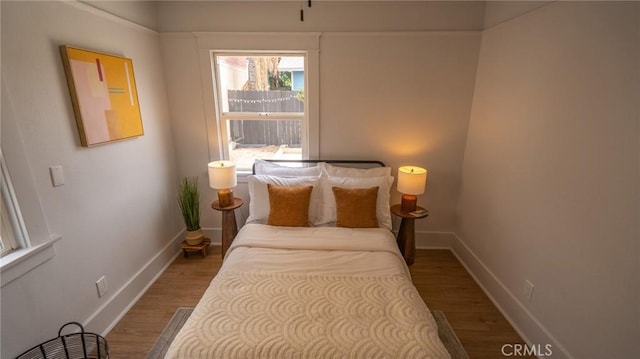 1520 Ohio Ave, Long Beach, CA 90804 - bedroom with baseboards and wood finished floors