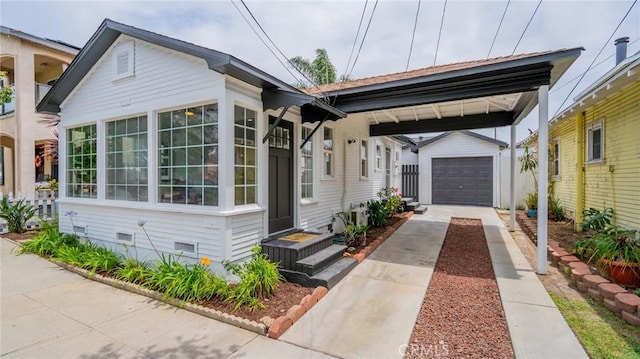 1520 Ohio Ave, Long Beach, CA 90804 - view of front of home with an outbuilding, driveway, crawl space, and a garage