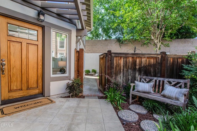 2759 Butter Creek Dr, Pasadena, CA 91107 - view of exterior entry with stucco siding and a patio