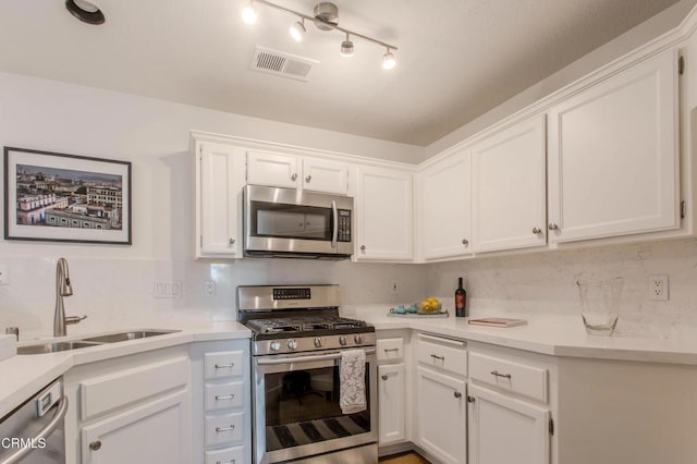 2759 Butter Creek Dr, Pasadena, CA 91107 - kitchen with appliances with stainless steel finishes, white cabinets, and light countertops