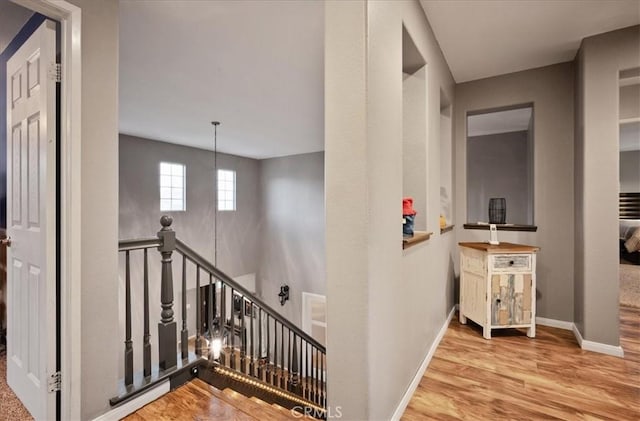 23501 Brigin Pl, Murrieta, CA 92562 - hall featuring an upstairs landing, wood finished floors, and baseboards