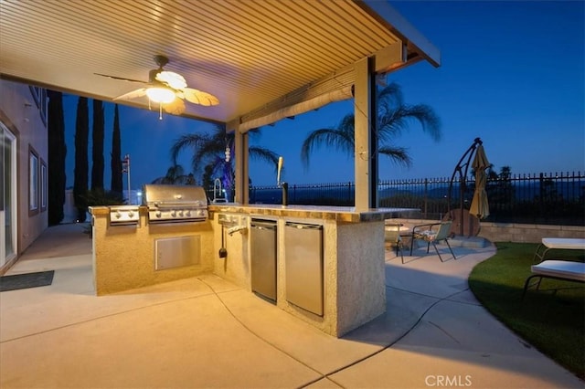 23501 Brigin Pl, Murrieta, CA 92562 - patio at twilight featuring a patio, ceiling fan, and a bar