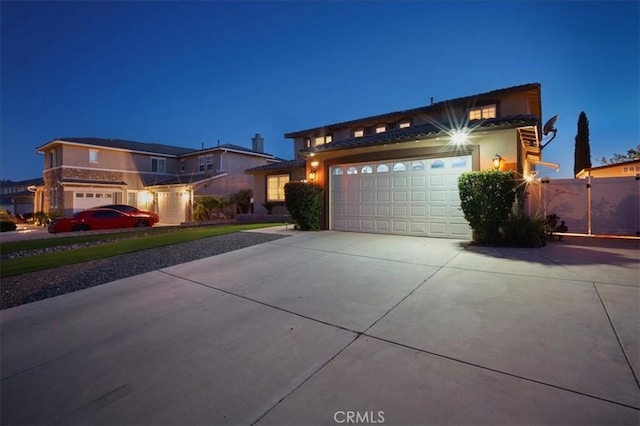 23501 Brigin Pl, Murrieta, CA 92562 - view of front of home featuring concrete driveway, an attached garage, and stucco siding