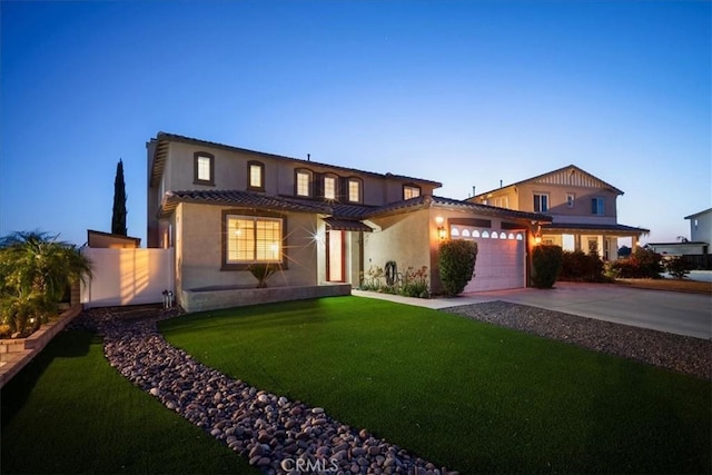 23501 Brigin Pl, Murrieta, CA 92562 - view of front of house with an attached garage, concrete driveway, a tiled roof, and stucco siding