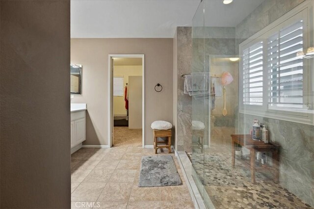 23501 Brigin Pl, Murrieta, CA 92562 - full bath featuring vanity, a shower stall, and baseboards