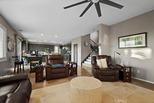 23501 Brigin Pl, Murrieta, CA 92562 - living area featuring stairway, ceiling fan, baseboards, and recessed lighting