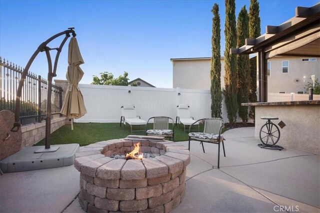 23501 Brigin Pl, Murrieta, CA 92562 - fenced backyard featuring a fire pit and a patio