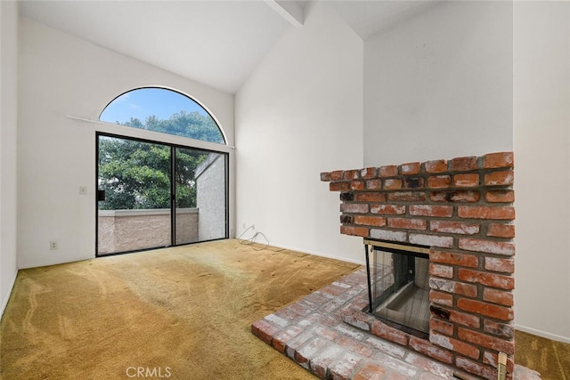 17202 Corbina Ln Unit 206, Huntington Beach, CA 92649 - unfurnished living room with carpet flooring, high vaulted ceiling, and a brick fireplace