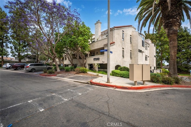17202 Corbina Ln Unit 206, Huntington Beach, CA 92649 - view of building exterior featuring uncovered parking
