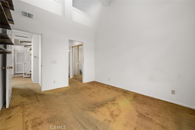 17202 Corbina Ln Unit 206, Huntington Beach, CA 92649 - unfurnished bedroom featuring carpet floors and a towering ceiling