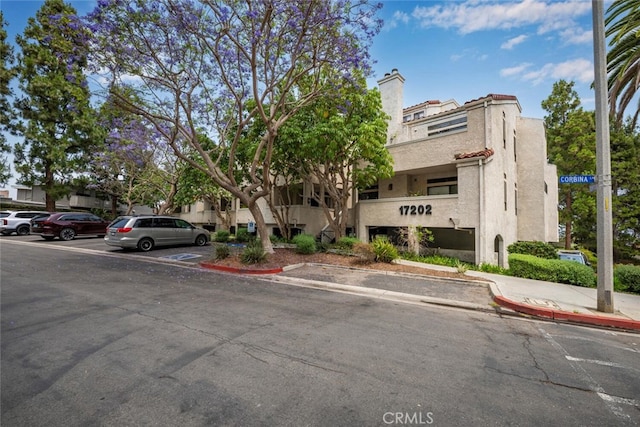 17202 Corbina Ln Unit 206, Huntington Beach, CA 92649 - view of building exterior featuring uncovered parking