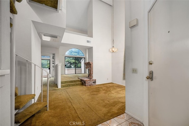 17202 Corbina Ln Unit 206, Huntington Beach, CA 92649 - carpeted foyer featuring a high ceiling and tile patterned flooring