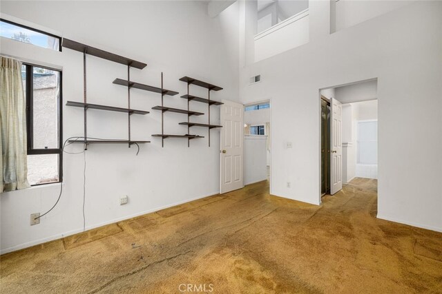 17202 Corbina Ln Unit 206, Huntington Beach, CA 92649 - unfurnished room featuring carpet flooring and a high ceiling