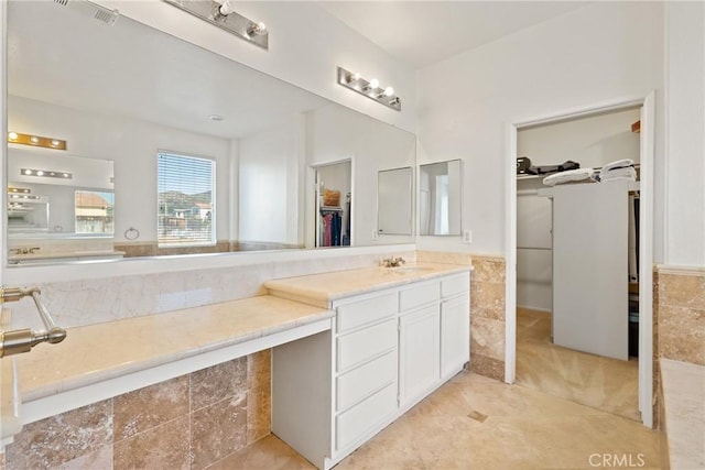 35358 Perla Pl, Wildomar, CA 92595 - bathroom featuring a spacious closet, vanity, and tile patterned flooring