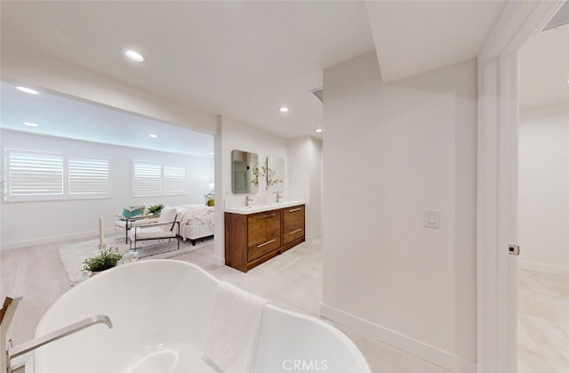 4263 E Ranch Gate Rd, Anaheim Hills, CA 92807 - full bathroom with a freestanding bath, vanity, baseboards, and recessed lighting