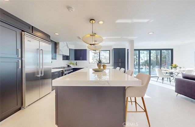 4263 E Ranch Gate Rd, Anaheim Hills, CA 92807 - kitchen with high quality appliances, a breakfast bar area, open floor plan, recessed lighting, and light stone counters