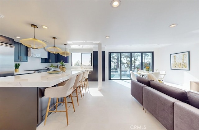 4263 E Ranch Gate Rd, Anaheim Hills, CA 92807 - kitchen featuring open floor plan, blue cabinetry, recessed lighting, a breakfast bar area, and a large island