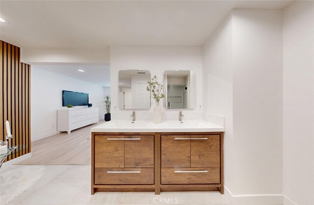 4263 E Ranch Gate Rd, Anaheim Hills, CA 92807 - bathroom with double vanity, baseboards, and recessed lighting