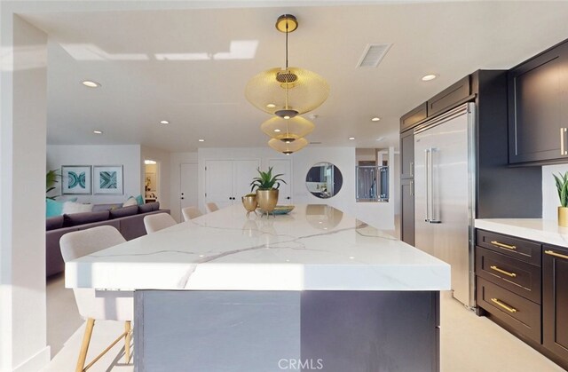 4263 E Ranch Gate Rd, Anaheim Hills, CA 92807 - kitchen featuring stainless steel built in refrigerator, a kitchen island, decorative light fixtures, recessed lighting, and light stone countertops