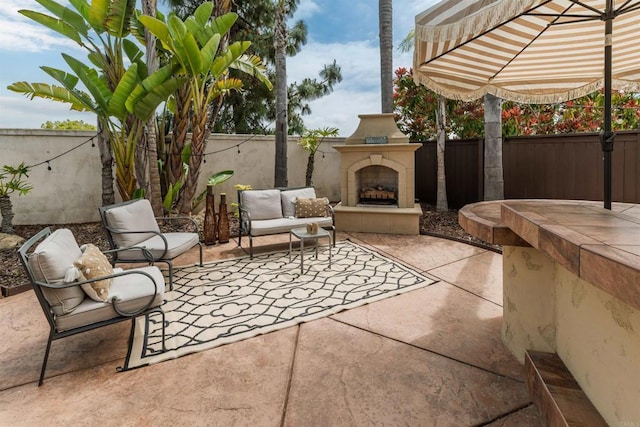 1749 Skimmer Ct, Carlsbad, CA 92011 - fenced backyard featuring a patio area and an outdoor living space with a fireplace