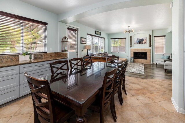 1749 Skimmer Ct, Carlsbad, CA 92011 - dining room with plenty of natural light, a chandelier, and light tile patterned flooring