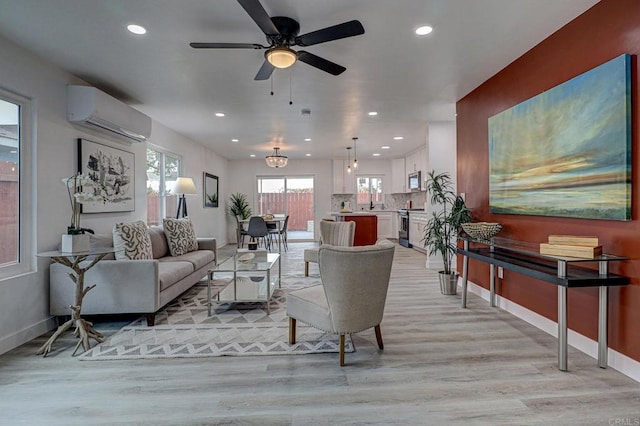 1320 Vinca Way, San Diego, CA 92114 - living area with a wall mounted AC, light wood-style floors, recessed lighting, baseboards, and ceiling fan