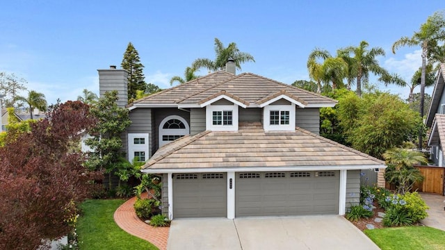 3686 Landfair Ct, San Diego, CA 92130 - view of front facade with a chimney, a garage, and driveway