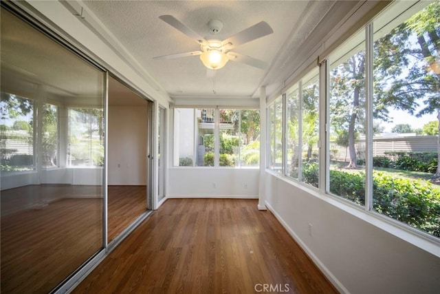 270 Avenida Sevilla Unit C, Laguna Woods, CA 92637 - unfurnished sunroom with a ceiling fan, wood finished floors, baseboards, and a textured ceiling