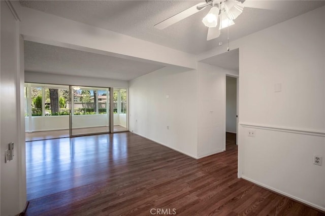 270 Avenida Sevilla Unit C, Laguna Woods, CA 92637 - spare room with wood finished floors, a ceiling fan, baseboards, and a textured ceiling