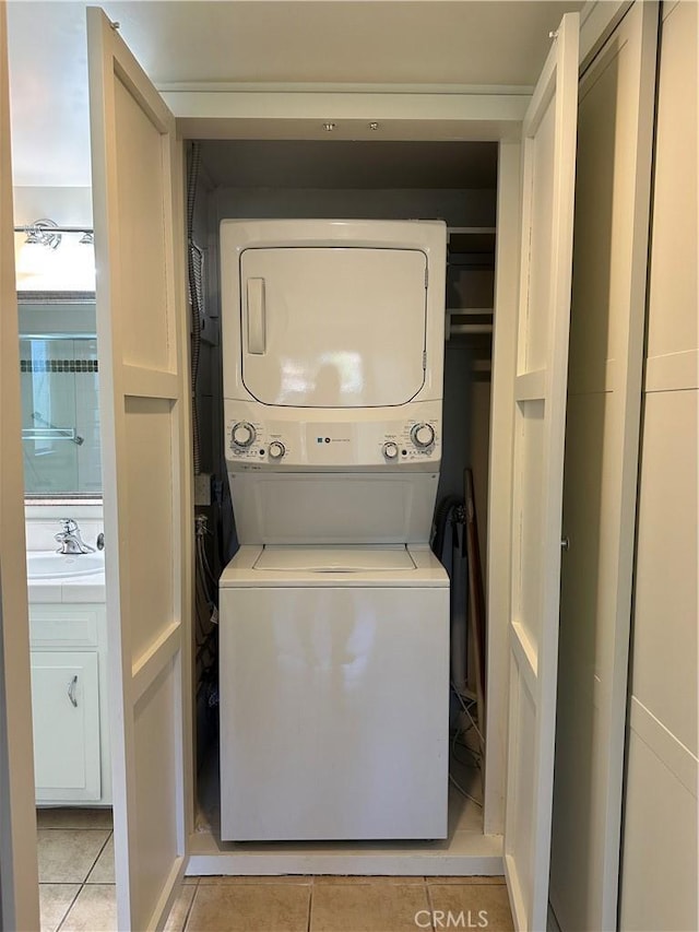 270 Avenida Sevilla Unit C, Laguna Woods, CA 92637 - washroom featuring stacked washing machine and dryer and light tile patterned floors