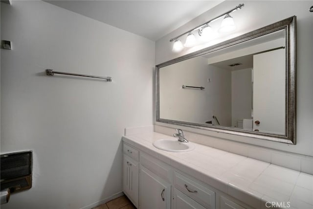 270 Avenida Sevilla Unit C, Laguna Woods, CA 92637 - bathroom with vanity, heating unit, and tile patterned flooring