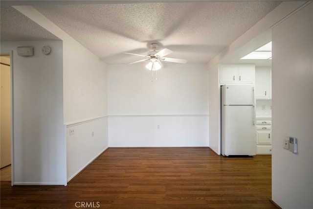 270 Avenida Sevilla Unit C, Laguna Woods, CA 92637 - unfurnished dining area with a ceiling fan, wood finished floors, and a textured ceiling