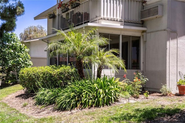 270 Avenida Sevilla Unit C, Laguna Woods, CA 92637 - view of home's exterior with a balcony and a wall mounted air conditioner