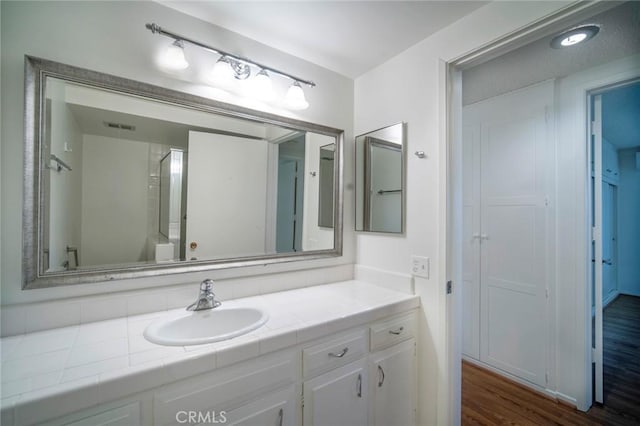 270 Avenida Sevilla Unit C, Laguna Woods, CA 92637 - bathroom with vanity and wood finished floors