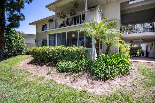 270 Avenida Sevilla Unit C, Laguna Woods, CA 92637 - back of property featuring a balcony, stairway, and stucco siding