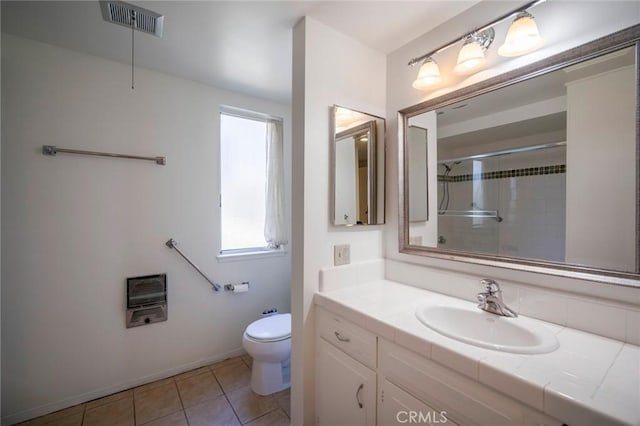 270 Avenida Sevilla Unit C, Laguna Woods, CA 92637 - bathroom featuring heating unit, toilet, vanity, a shower, and tile patterned flooring