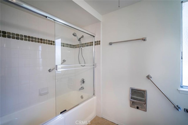 270 Avenida Sevilla Unit C, Laguna Woods, CA 92637 - bathroom featuring combined bath / shower with glass door and heating unit