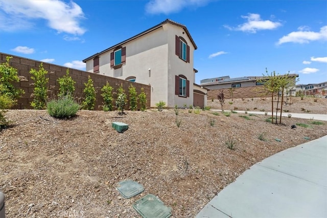 11653 Couples Ct, Beaumont, CA 92223 - view of side of property with stucco siding